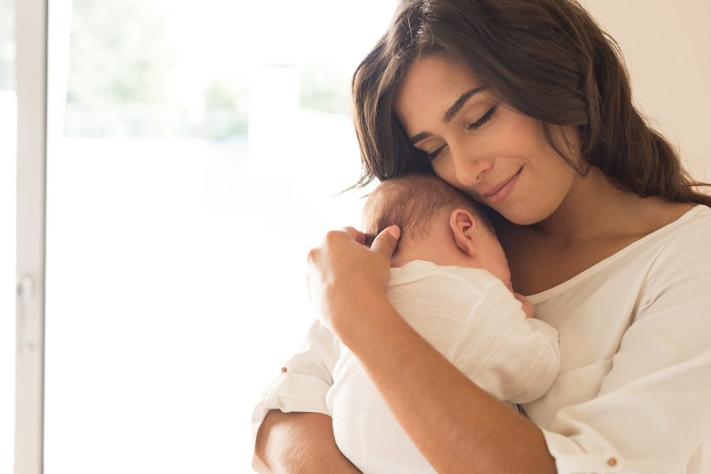 Mother holding newborn baby