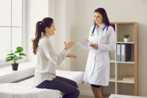 woman speaking to her gynecologist.