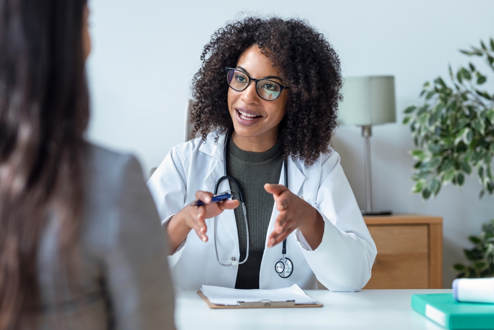 female doctor talking to patient.