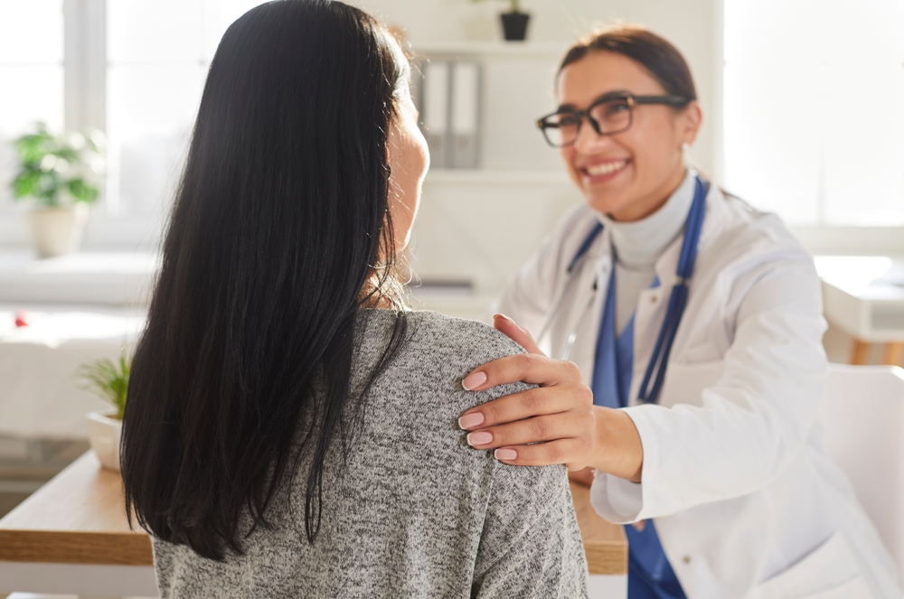female doctor talking to patient.